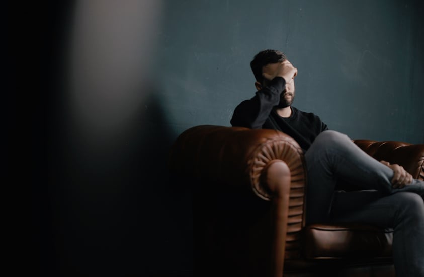 Frustrated Man Sitting on the Couch